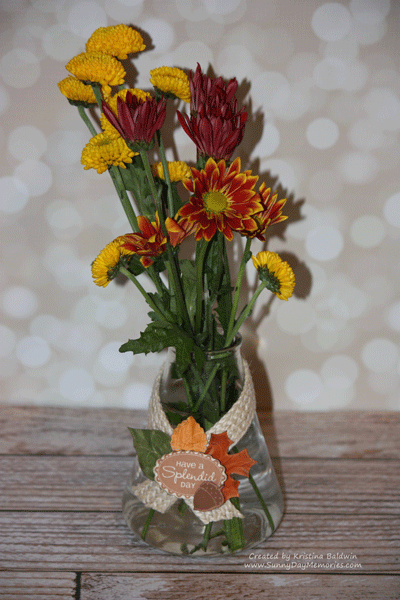 flowers in upcycled beaker vase